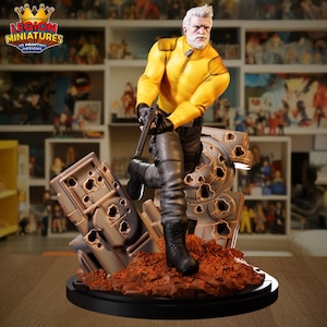 May include: A detailed figurine of a man in a yellow jacket and black pants, holding a gun. The figure is standing on a base with a war-torn, metallic structure. The base is black, and the overall color scheme includes yellow, black, gray, and brown.