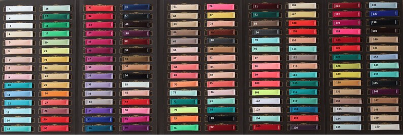May include: A color chart with 150 different fabric swatches. The swatches are arranged in rows and columns, and each swatch is labeled with a number. The colors range from light to dark, and include a variety of shades of red, blue, green, yellow, orange, purple, pink, brown, and gray.