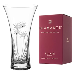 May include: A clear glass vase with an etched floral design. The vase is part of the Diamante Elixir Collection, which is made of fine lead-free crystal.