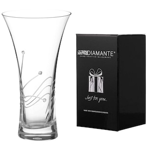 May include: A clear glass vase with a swirl design and crystal accents. The vase is packaged in a black box with the text "Diamante" and "Just for you..." printed on it.