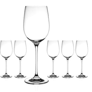 May include: Set of six clear glass wine glasses, including one larger glass in the centre.