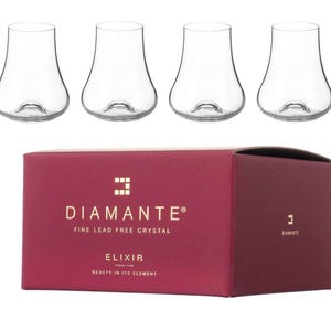 May include: Four clear, stemless wine glasses with a bulbous base and a narrow opening are displayed above a burgundy box. The box features the brand name "Diamante" and the word "Elixir" in white text.