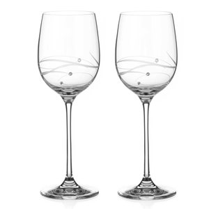 May include: Two clear glass wine glasses with a delicate swirl design and small crystal accents.