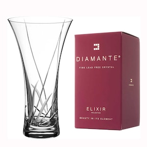 May include: A clear glass vase with a delicate etched design of stylized grass. The vase is part of the Diamante Elixir Collection, which is made of fine lead-free crystal.