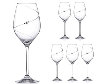 May include: Set of six clear glass wine glasses with a silver swirl design and a small silver bead accent.