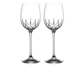 May include: Two clear crystal wine glasses with a diamond pattern.