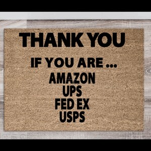 May include: A brown doormat with the text "THANK YOU IF YOU ARE... AMAZON UPS FED EX USPS" in black.