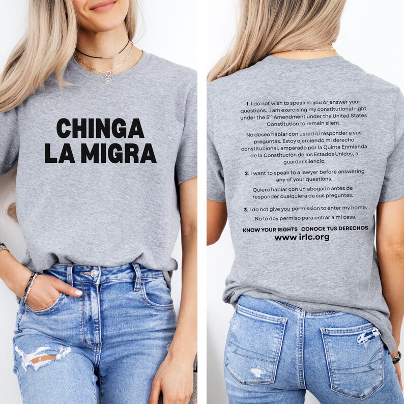 May include: A gray t-shirt with the phrase "CHINGA LA MIGRA" in large black letters. The back of the shirt has text in English and Spanish about constitutional rights, including "KNOW YOUR RIGHTS" and the website www.irlc.org.