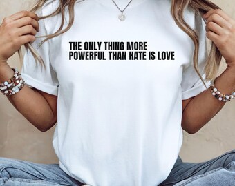 The Only Thing More Powerful Than Hate Is Love vneck shirt, Superbowl 2026 tee, Positive Quote, Activist tee, Anti Trump Shirt