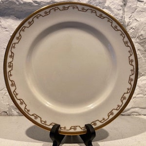 Antique Royal Doulton dinner plate, Robert Allen Studios, circa 1920, art deco motif, gold embossed rim