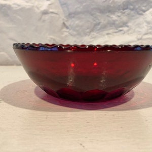 Vintage finger bowl/candy dish/rose bowl in ruby red with thumbprints at base and scalloped edge.