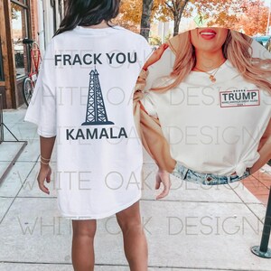 May include: Two white t-shirts with different political slogans printed on them. The first shirt has a black oil rig graphic and the text "FRACK YOU KAMALA". The second shirt has the text "TRUMP MAKE AMERICA GREAT AGAIN 2024".