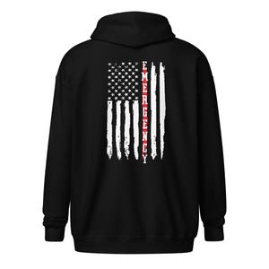 May include: Black hooded sweatshirt with a white American flag design and the word "EMERGENCY" in red lettering down the center of the flag.