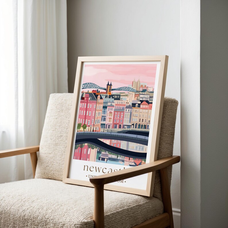 a framed illustration of a cityscape with buildings, a bridge, and a river, displayed on a chair.