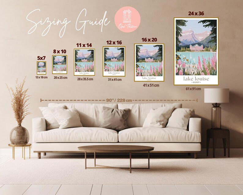 a living room with a white couch and pictures on the wall