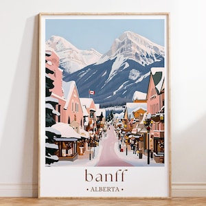 A poster depicting a snowy mountain town in Alberta, Canada, with colorful buildings, a snow-covered street, and a Canadian flag flying in the distance.