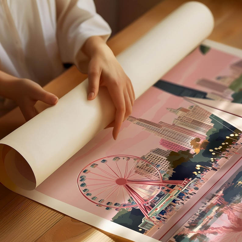 a person holding a piece of paper with a picture of a ferris wheel on it