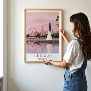 a woman standing next to a wall with a painting on it