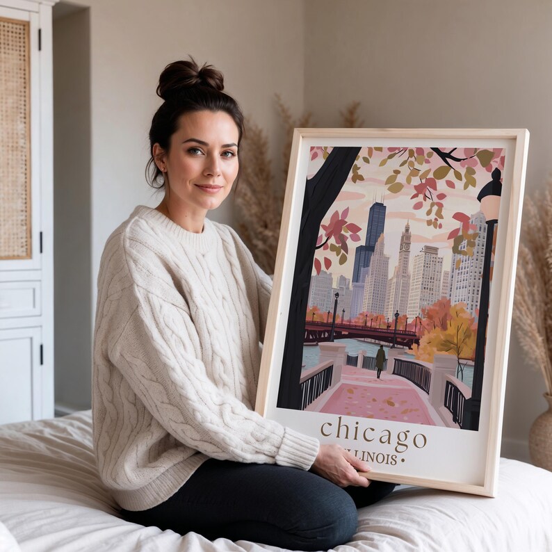 a woman sitting on a bed holding a picture