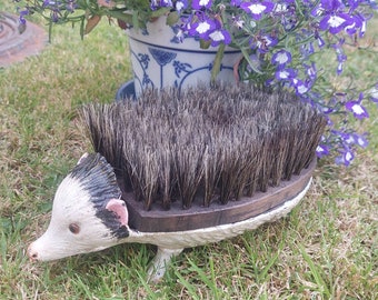 An ornamental vintage boot scraper cleaner in the form of an albino hedgehog. Cast iron garden ornament. Hedge pig. Mrs Tiggywinkle.