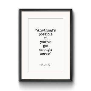 May include: A black framed print with a white background and a quote in black text: "Anything's possible if you've got enough nerve." - Bing Crosby.