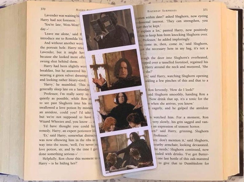 May include: A rectangular bookmark featuring three images of a character from the Harry Potter film series. The images are in a vertical arrangement, showing the character in different poses. The bookmark is set against the backdrop of an open book.