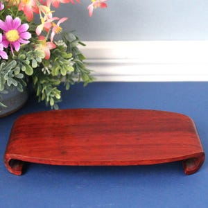 May include: A white ceramic mug with a black handle and the text "But First, Coffee" in a bold, black font. The mug is sitting on a wooden surface. The mug appears to be 12 ounces.