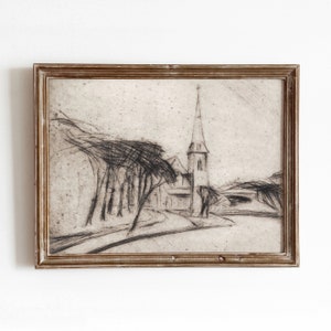 Op de afbeelding: Een ingelijste zwart-wit schets van een kerk met een hoge toren en bomen op de voorgrond. De schets is op getextureerd papier en heeft een rustieke, vintage uitstraling.