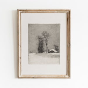 May include: A framed black and white drawing of a snowy landscape with a small house and trees. The drawing is in a light wood frame.