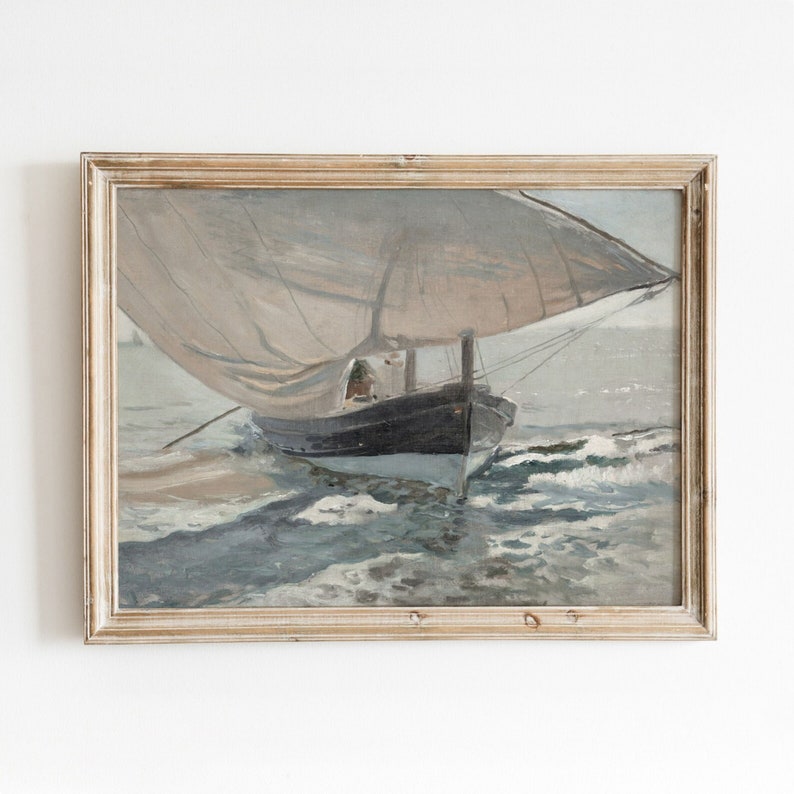 May include: A framed painting of a sailboat with a white sail, sailing on a blue and white sea. The boat is dark blue and white and has a person on board.