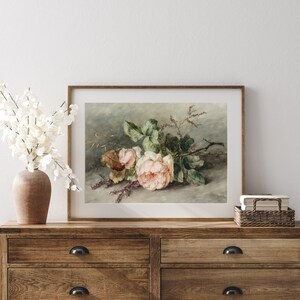 May include: A vintage style print of a pink rose bouquet with green leaves and stems on a light gray background.
