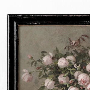 May include: A framed floral painting featuring a bouquet of pink roses. The artwork is set against a muted green background and framed in a distressed black wooden frame with a gold inner edge. The roses are in full bloom.