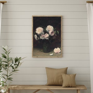 May include: A framed painting of a bouquet of white and pink roses in a green vase on a dark background.