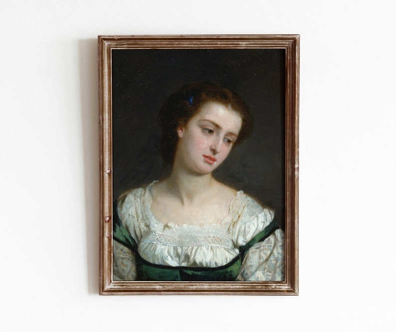 May include: A framed oil painting of a woman with dark hair and a green and white dress. She is looking down and to the left. The painting is in a simple wooden frame.