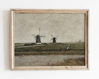 May include: A framed painting depicting a landscape with three windmills in the distance. The windmills are painted in shades of brown and white against a cloudy sky. The foreground features a body of water and green grass.