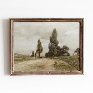 May include: A framed landscape painting in muted tones. The artwork shows a dirt track with tall trees under a cloudy sky. The frame is a warm brown colour.
