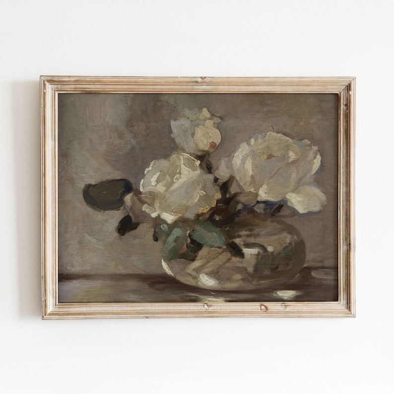 May include: A framed painting of a still life featuring a bouquet of white flowers in a vase. The flowers are painted in a loose, impressionistic style, with soft brushstrokes and a muted color palette.