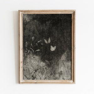 May include: A framed black and white print of a nature scene with two white butterflies flying over a field of flowers and grasses.