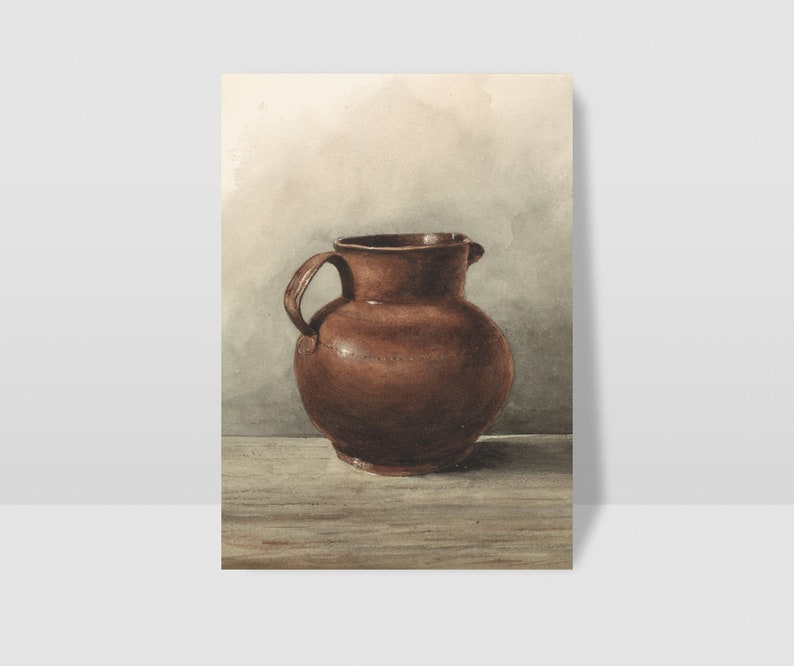 May include: A brown ceramic pitcher with a rounded body and a handle on one side. The pitcher is sitting on a wooden surface.