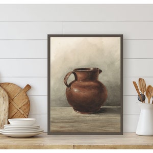 May include: A watercolor painting of a brown ceramic pitcher on a wooden table. The background is a light brown with a hint of blue.