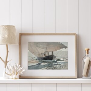 May include: A framed print of a painting depicting a sailboat with a white sail and a dark hull, sailing on a choppy sea. The painting is set against a light blue sky with white clouds.