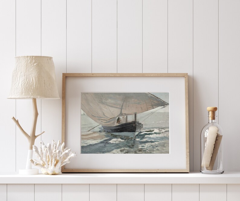 May include: A framed print of a painting depicting a sailboat with a white sail and a dark hull, sailing on a choppy sea. The painting is set against a light blue sky with white clouds.