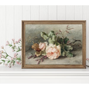 May include: A framed painting of a bouquet of pink roses with green leaves and stems. The roses are arranged on a gray background with a few sprigs of pink flowers.