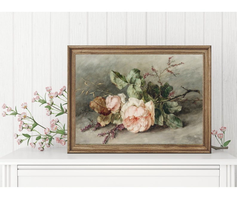 May include: A framed painting of a bouquet of pink roses with green leaves and stems. The roses are arranged on a gray background with a few sprigs of pink flowers.