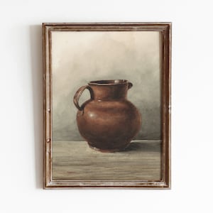 May include: A watercolor painting of a brown ceramic pitcher in a wooden frame.
