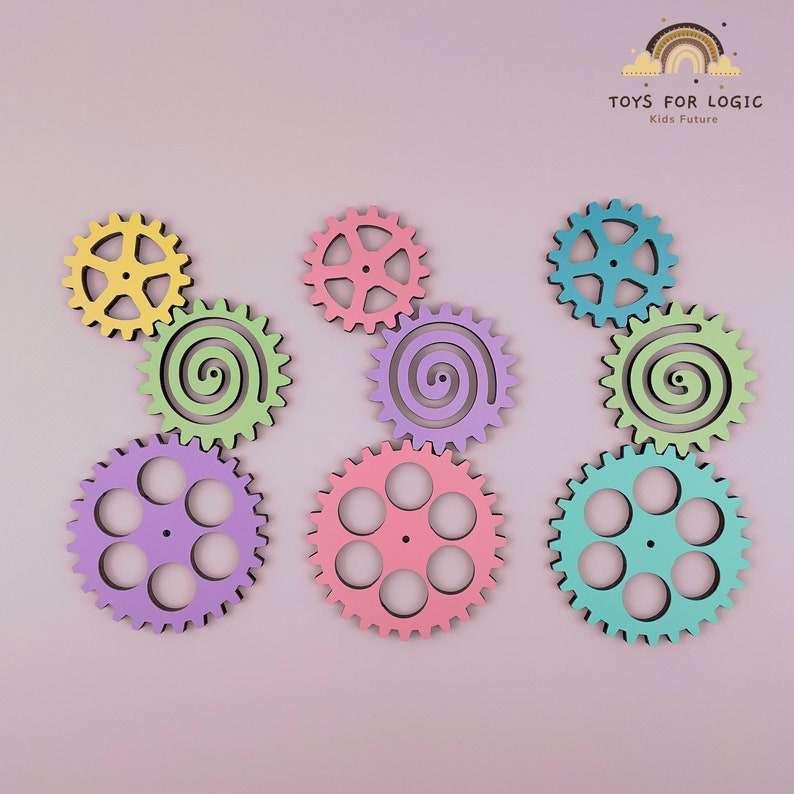 May include: A set of nine colorful wooden gears, including three spiral gears and six gears with multiple holes. The gears are arranged in three groups of three, with each group featuring a different color scheme: yellow, green, and purple.