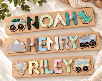 May include: Three rectangular wooden name puzzles featuring the names NOAH, HENRY, and RILEY. Each puzzle includes colorful wooden letters with small knobs and themed shapes like a monster truck, dinosaur, mountain, train, hot air balloon, and bus.