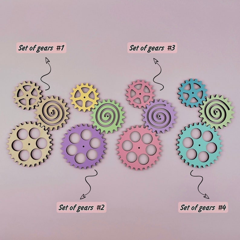 May include: Four sets of colorful wooden gears, each set with a different color scheme. The sets are labeled "Set of gears #1", "Set of gears #2", "Set of gears #3", and "Set of gears #4".