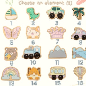 May include: Wooden puzzle pieces in various shapes, including a sailboat, dinosaur, car, palm tree, butterfly, cat, crown, unicorn car, bear, train, mountains, airplane, rainbow, fox, school bus, and hot air balloon. The text "Choose an element(s)" is at the top.