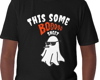 May include: Black t-shirt with white text that says "This some Boo Sheet" and a cartoon ghost wearing sunglasses.